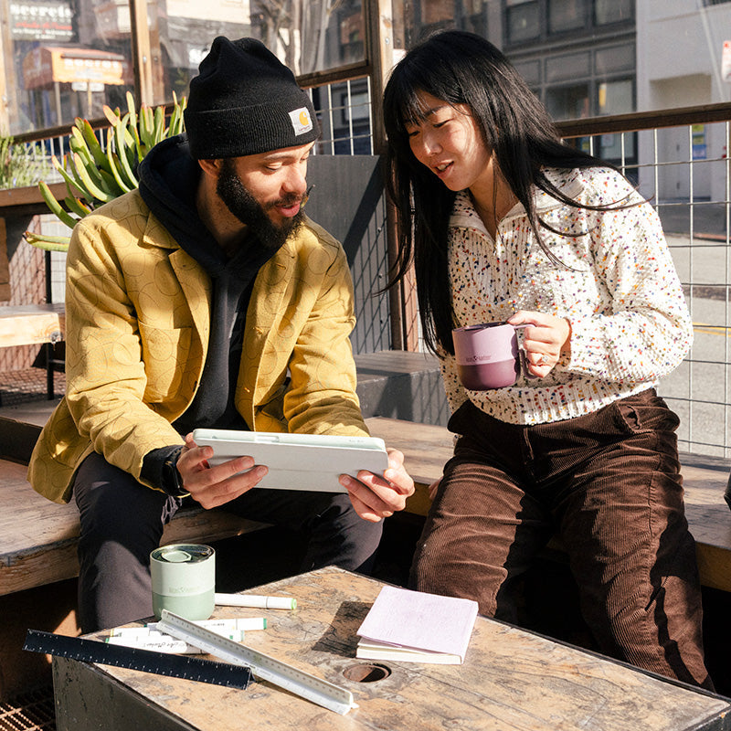 12oz-rise-mug-j5 12oz_rise_coffee_mug_dusty_orchid_couple_city_patio_square.jpg