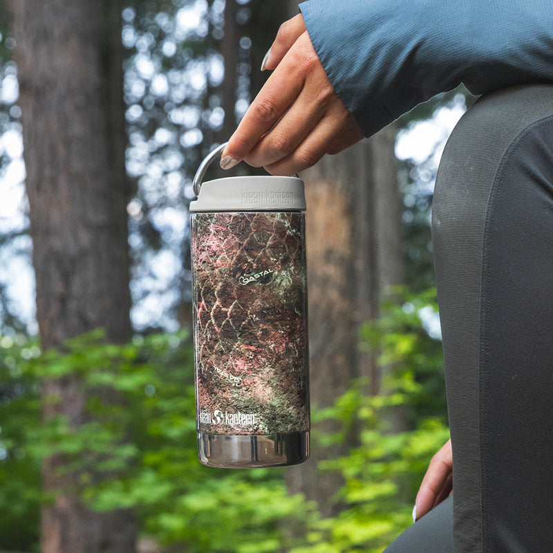 12oz-tkwide-with-twist-cap-mossy-oak-y5 12oz_tumbler_mossyoak_rainbowtrout_hand_closeup_square.jpg