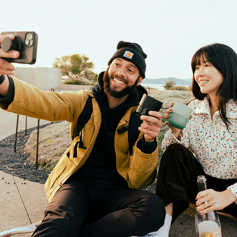bring-your-own-party-kit-tumblers-and-cocktails-s6 8oz_rise_lowball_black_iceberg_couple_selfie_city_square.jpg