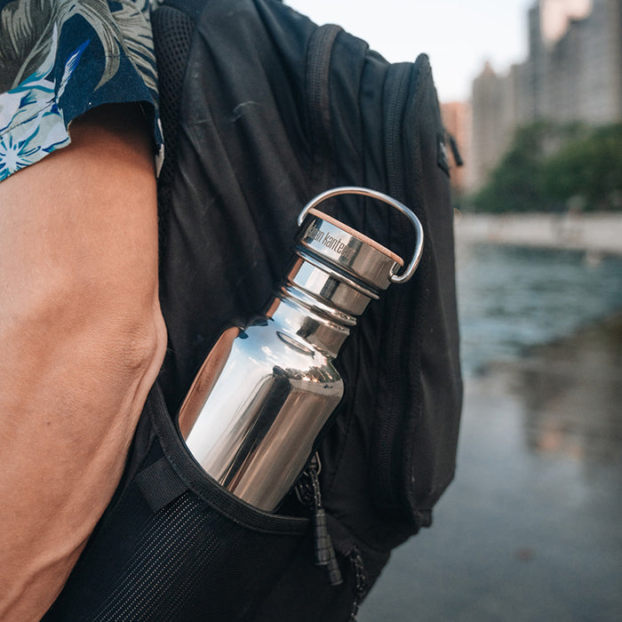 27oz-reflect-with-bamboo-cap-k6 K27SSLRF-MS-BAMBOO_reflect-bottle_backpack_lifestyle.jpg